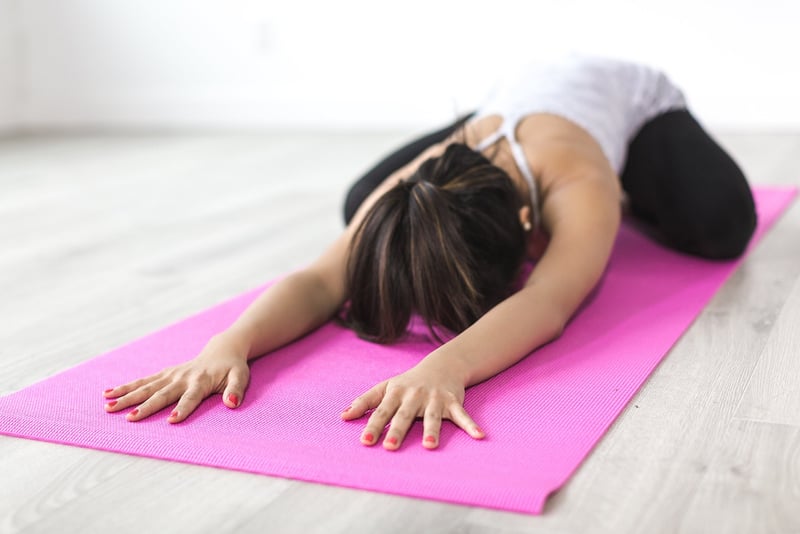 Woman practicing restorative yoga